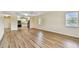 Open concept living area featuring wood floors and natural light at 701 Poinsettia Rd # 340, Belleair, FL 33756