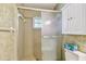 The bathroom features a tiled shower with a sliding glass door at 701 Poinsettia Rd # 340, Belleair, FL 33756