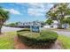 Community sign for 1706 Bellaire Forest with a view of the complex and ample parking at 701 Poinsettia Rd # 340, Belleair, FL 33756