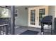 Relaxing porch features a grill and ample space for outdoor dining or lounging at 7152 Sandy Ln, Wesley Chapel, FL 33544