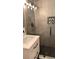 Modern bathroom with glass enclosed shower, mosaic tile accent, and sleek vanity at 7152 Sandy Ln, Wesley Chapel, FL 33544
