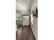 Bright bedroom featuring hard wood floors, white walls, with a large window at 7152 Sandy Ln, Wesley Chapel, FL 33544