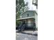 Charming two-story home features a welcoming front porch with sleek, modern railings at 7152 Sandy Ln, Wesley Chapel, FL 33544