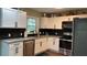Kitchen showcasing granite countertops, white cabinets and modern stainless steel appliances at 7152 Sandy Ln, Wesley Chapel, FL 33544