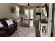 An open-concept living room and kitchen area featuring wood floors at 7152 Sandy Ln, Wesley Chapel, FL 33544