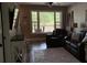 Cozy living room offers a view of the deck, complemented by stylish furnishings and a neutral palette at 7152 Sandy Ln, Wesley Chapel, FL 33544