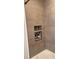 Stylish shower featuring built-in shelving units with decorative mosaic tile accents, providing convenient storage at 7152 Sandy Ln, Wesley Chapel, FL 33544