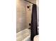 Modern shower space with black fixtures and neutral tilework creates a clean and functional bathroom at 7152 Sandy Ln, Wesley Chapel, FL 33544
