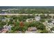 Aerial view of the property nestled among trees near residential areas and a highway at 717 E 137Th Ave, Tampa, FL 33613