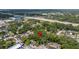 Aerial view of land featuring mature trees near a busy highway, close to local amenities at 717 E 137Th Ave, Tampa, FL 33613
