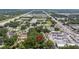 Aerial view of land surrounded by local shops and housing, conveniently located by a busy road at 717 E 137Th Ave, Tampa, FL 33613