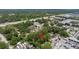 High angle shot of tree covered lot by local commercial business, with highway nearby at 717 E 137Th Ave, Tampa, FL 33613