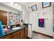 Bathroom with skylights, a shower with a dinosaur-themed curtain, and a vanity with a black countertop at 717 E 137Th Ave, Tampa, FL 33613