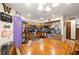 Bright eat-in kitchen area featuring a dining table with decor and stainless steel appliances, including refrigerator and oven at 717 E 137Th Ave, Tampa, FL 33613
