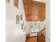 Upward stairwell shot showing wooden stairs, wood ceiling, and decorated walls at 717 E 137Th Ave, Tampa, FL 33613