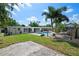 Aerial view of the home's backyard featuring a pool, patio, and hammock at 7304 Lakeside Blvd, Tampa, FL 33614