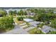Charming single-Gathering home with lush greenery, featuring a pool, spacious driveway, and close proximity to the lake at 7304 Lakeside Blvd, Tampa, FL 33614