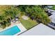 Aerial shot showcases a backyard with a pool, hammock, and grassy area, ideal for outdoor activities at 7304 Lakeside Blvd, Tampa, FL 33614