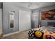 Bedroom with closet and colorful decor at 7304 Lakeside Blvd, Tampa, FL 33614