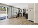 Bright bonus room with wood-look floors and backyard access at 7304 Lakeside Blvd, Tampa, FL 33614