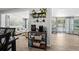 Dining area with coffee bar leads into the living room, with lots of natural light coming in at 7304 Lakeside Blvd, Tampa, FL 33614