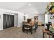 Inviting dining room with a rustic table, dark accents, and modern decor at 7304 Lakeside Blvd, Tampa, FL 33614
