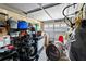 Cluttered garage interior, featuring shelving and equipment, ready for organization at 7304 Lakeside Blvd, Tampa, FL 33614