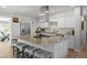 Stylish kitchen island with seating, granite countertops, and stainless-steel appliances at 7304 Lakeside Blvd, Tampa, FL 33614