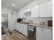 Beautiful kitchen with white cabinets, modern appliances, and stylish backsplash at 7304 Lakeside Blvd, Tampa, FL 33614