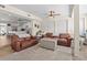 Comfortable living room with hardwood floors, ceiling fan, and open floor plan to kitchen at 7304 Lakeside Blvd, Tampa, FL 33614