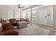 Bright living room showcasing comfortable seating, a neutral palette, and multiple windows at 7304 Lakeside Blvd, Tampa, FL 33614
