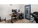 Home office space with wood-look floors and a view of the door at 7304 Lakeside Blvd, Tampa, FL 33614