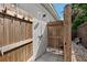 Private outdoor shower with wooden enclosure, perfect for rinsing off after a swim or beach trip at 7304 Lakeside Blvd, Tampa, FL 33614