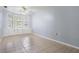 Bright bedroom featuring tile floors, fan, and built-in drawers under bay window at 7347 Pulsar St, New Port Richey, FL 34652