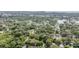 Expansive areal view of a neighborhood near the water and surrounded by foliage at 7347 Pulsar St, New Port Richey, FL 34652