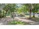 Charming single-story home with mature trees and a cozy front yard at 7347 Pulsar St, New Port Richey, FL 34652