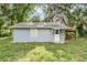 Exterior of home with a covered porch at 7347 Pulsar St, New Port Richey, FL 34652