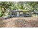 Charming home exterior with landscaping and a white picket fence at 7347 Pulsar St, New Port Richey, FL 34652