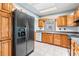 Well-equipped kitchen features wood cabinets and modern appliances at 7347 Pulsar St, New Port Richey, FL 34652