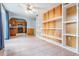 Open concept living room with built in shelving and access to the kitchen at 7347 Pulsar St, New Port Richey, FL 34652