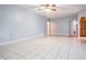 Expansive living room with tile floors, leading to other rooms in the house at 7347 Pulsar St, New Port Richey, FL 34652