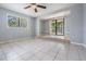 Bright and spacious living room featuring tile floors and access to the outside at 7347 Pulsar St, New Port Richey, FL 34652