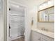 Bathroom featuring a walk-in shower, vanity with marble countertop, and neutral color scheme at 7360 Ulmerton Rd # 18A, Largo, FL 33771
