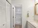 Bright bathroom with a walk-in shower, vanity, and light fixtures at 7360 Ulmerton Rd # 18A, Largo, FL 33771