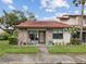 Charming single-story home featuring a brick facade, well-manicured lawn, and inviting curb appeal at 7360 Ulmerton Rd # 18A, Largo, FL 33771