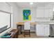 Bright kitchen area featuring stainless appliances, granite countertops, and a built in desk area to make a great office space at 7360 Ulmerton Rd # 18A, Largo, FL 33771