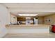 Community kitchen featuring ample counter space, cabinets, a sink, and appliances at 7360 Ulmerton Rd # 18A, Largo, FL 33771