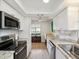 Well-lit kitchen featuring stainless steel appliances, spacious countertops, and modern cabinets for a clean, stylish look at 7360 Ulmerton Rd # 18A, Largo, FL 33771