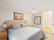 Main bedroom with a king bed, artwork, ceiling fan, and neutral decor at 7360 Ulmerton Rd # 18A, Largo, FL 33771