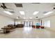 Bright meeting room featuring comfortable couches, chairs, and an American flag at 7360 Ulmerton Rd # 18A, Largo, FL 33771